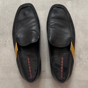 Men's Prada black leather loafers w/yellow Prada stripe. Slip on / US SZ 8